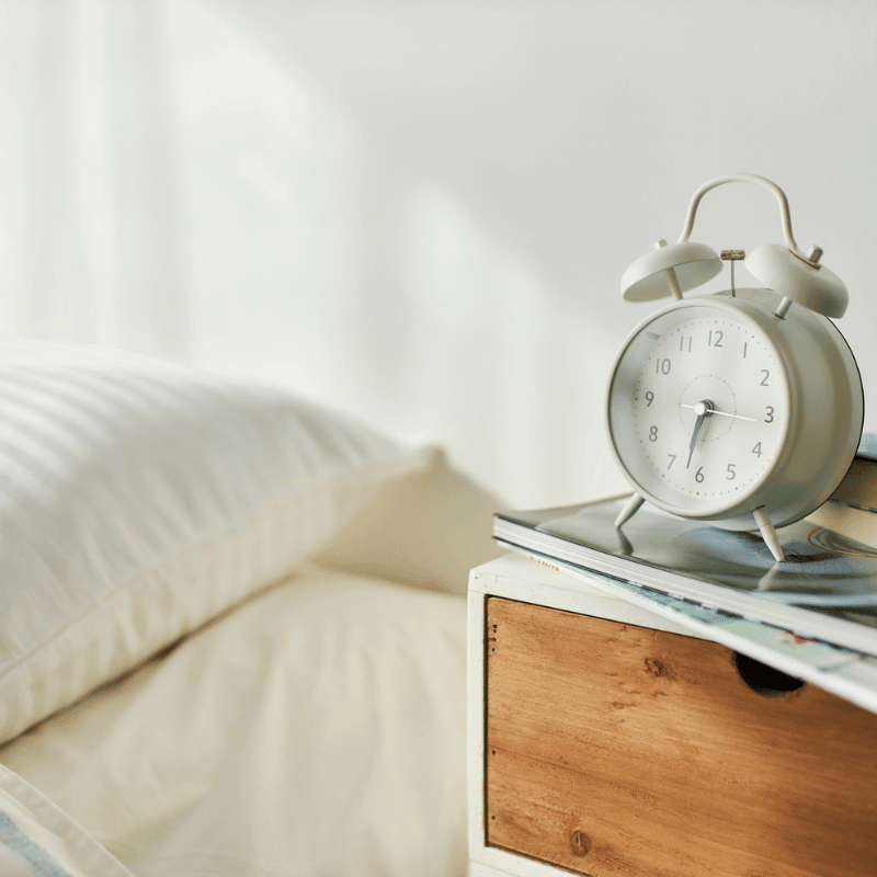 Alarm clock on a nightstand.